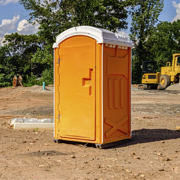 what is the cost difference between standard and deluxe portable restroom rentals in Aurelius